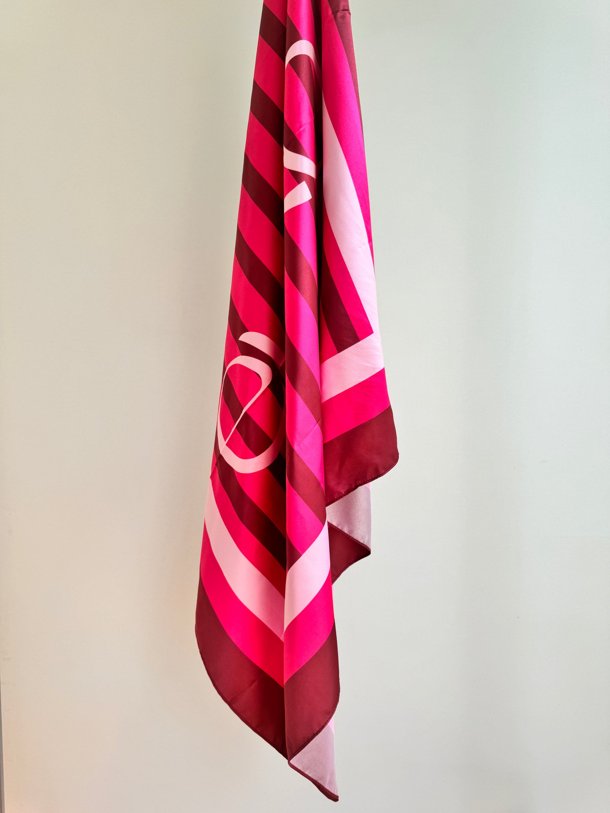 Bold pink and berry scarf worn as shawl – EVELO