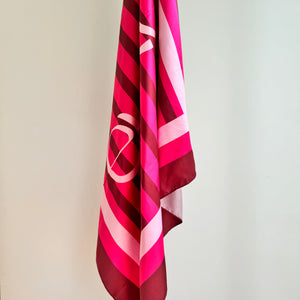 Bold pink and berry scarf worn as shawl – EVELO