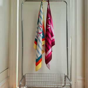 Australian-designed pink scarf with bright stripe pattern